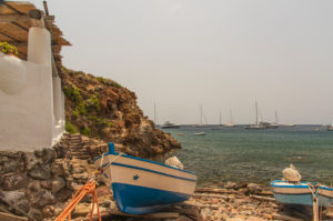 Sicily - Sunny impressions of the Aeolian Islands, also known as Aeolian Islands or Isole Eolie: Lipari, Stromboli, Salina, Vulcano, Panarea, Filicudi and Alicudi. Two fishing boats in Zimmari Bay, Panarea. Sicily - Sunny impressions of the Aeolian Islands, also known as Aeolian Islands or Isole Eolie: Lipari, Stromboli, Salina, Vulcano, Panarea, Filicudi and Alicudi. Two fishing boats in Zimmari Bay, Panarea.
